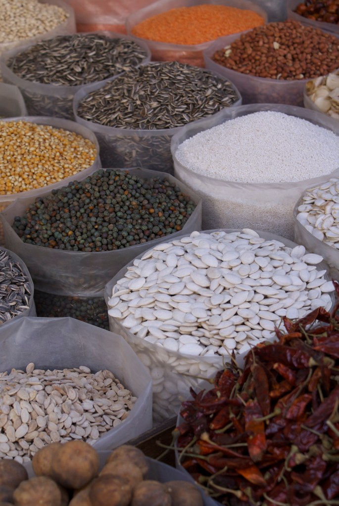 bags filled with seeds, lentils, nuts, dried lemon and chili - manama souk