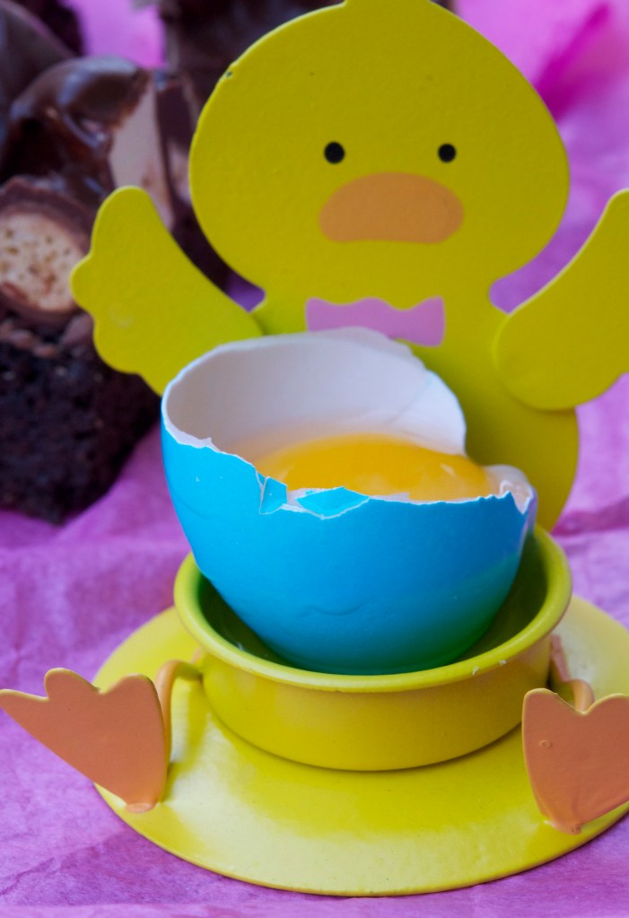 dyed egg in a tea light holder