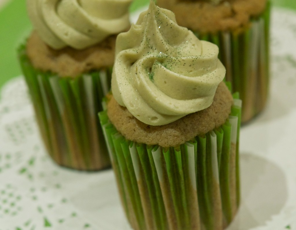 matcha tea and lemon cupcakes with matcha tea buttercream frosting dusted with edible glitter